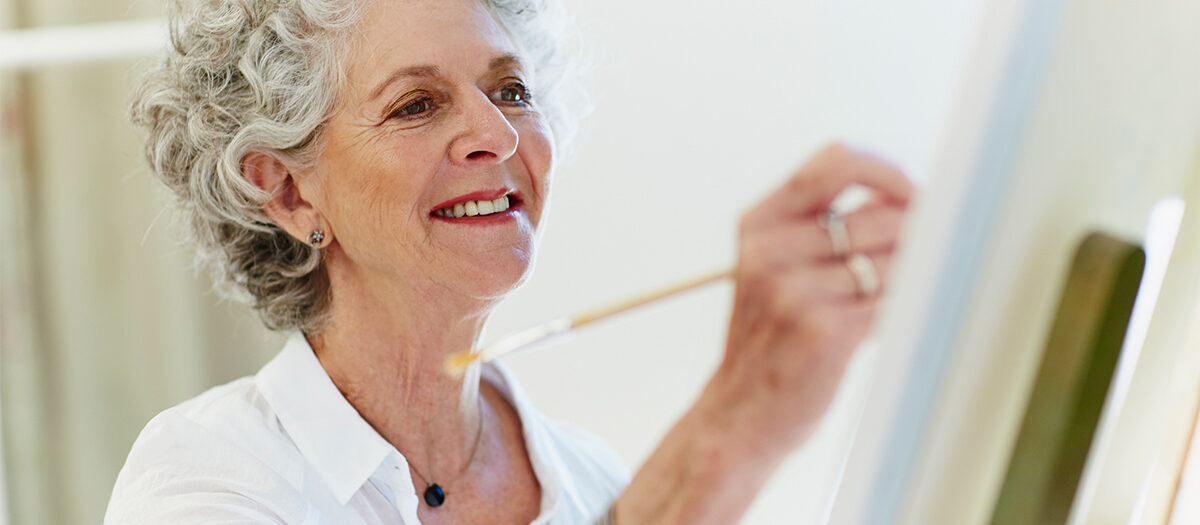 Senior woman painting