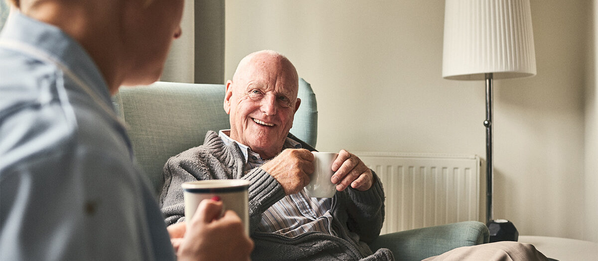 Older couple enjoying a cup of coffee