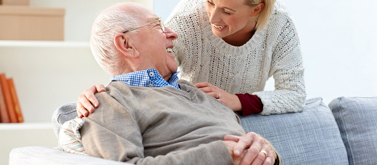 Senior man talking with a caregiver