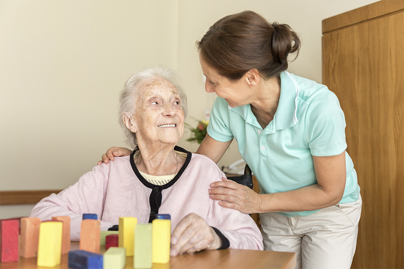 Memory care resident with a caregiver