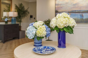 Arrangements of blue and white hydrangeas in blue vases