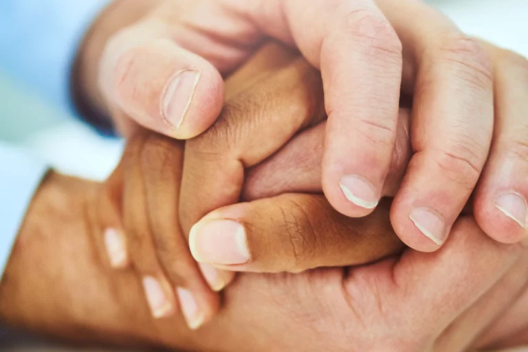 Caring holding hands