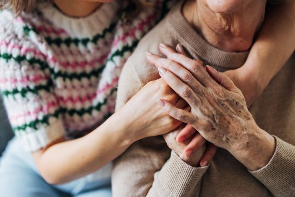 A family caregiver caring for their loved one with dementia