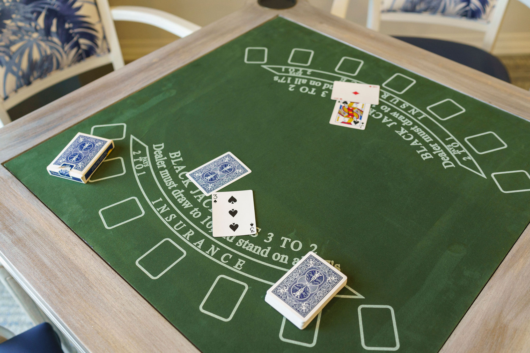 Playing cards on a blackjack table with player showing blackjack